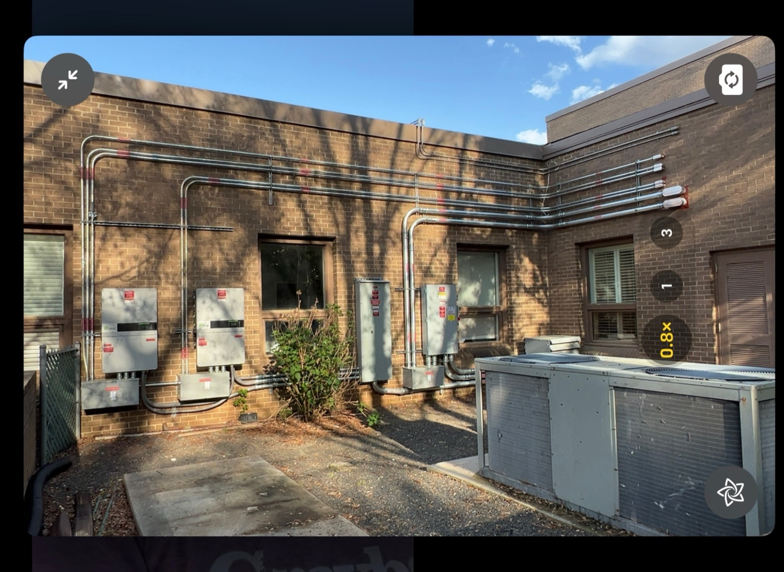 Commercial conduit and disconnects on a brick building