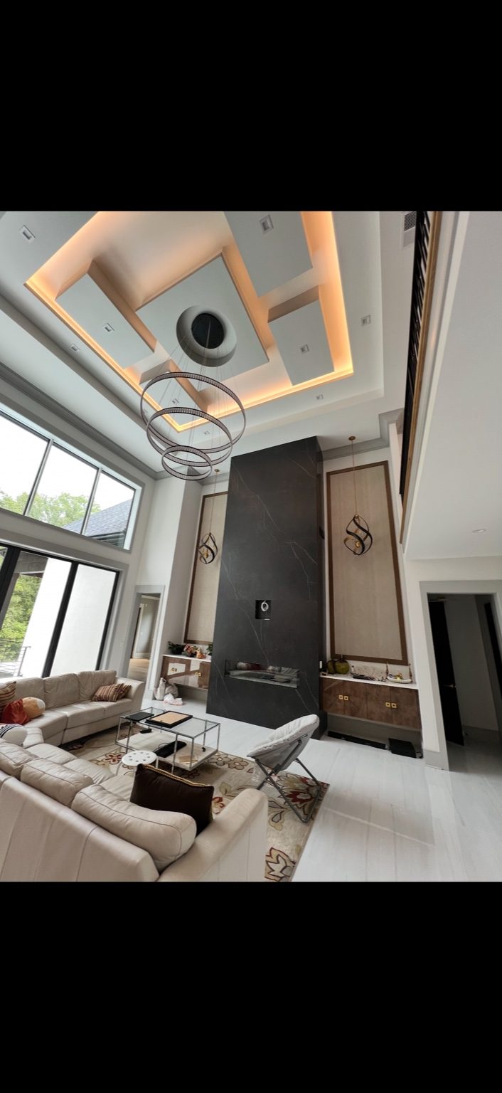 Two-story living room with feature lighting